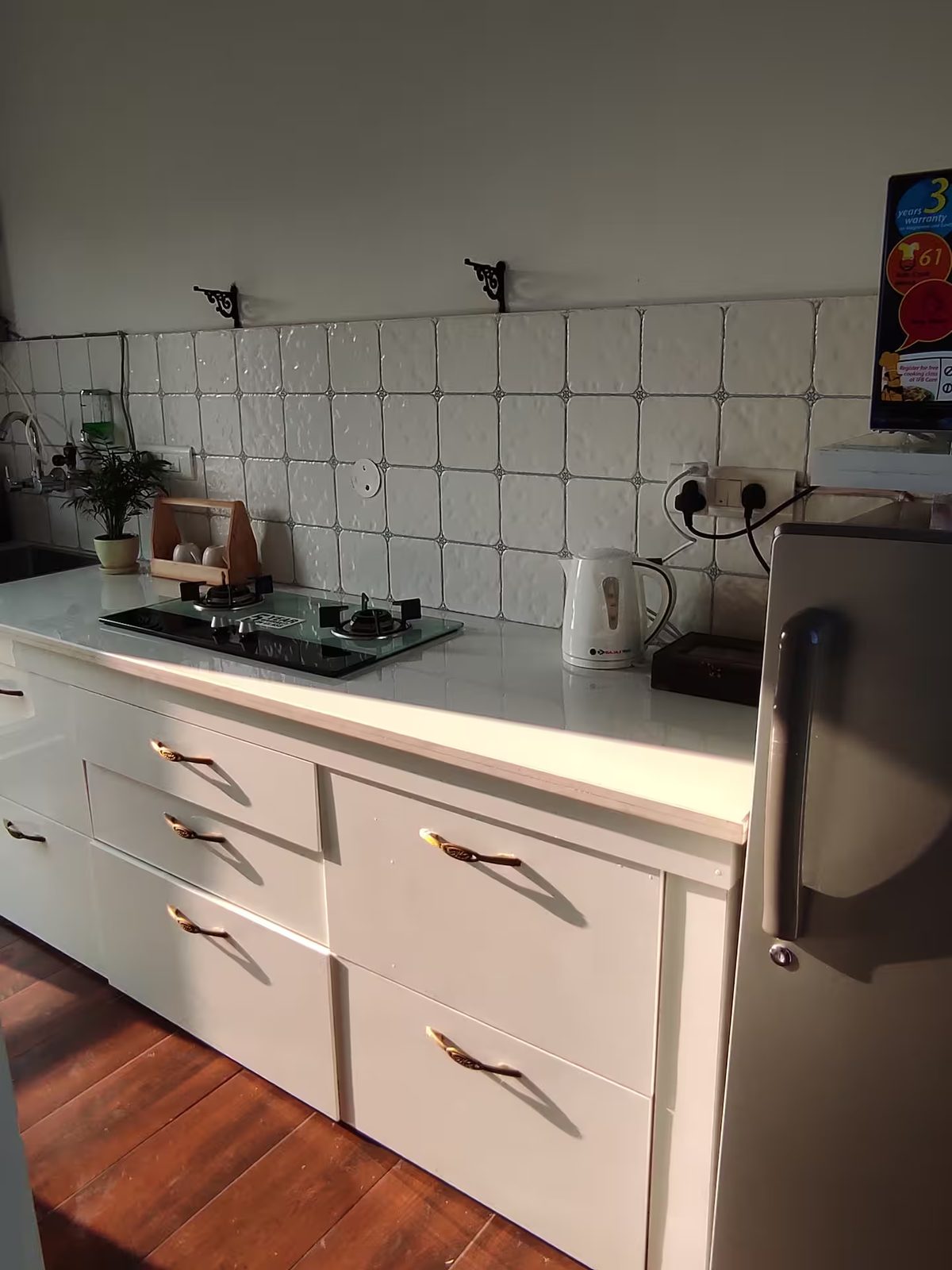 Kitchen Counter with Cooktop and Refrigerator
