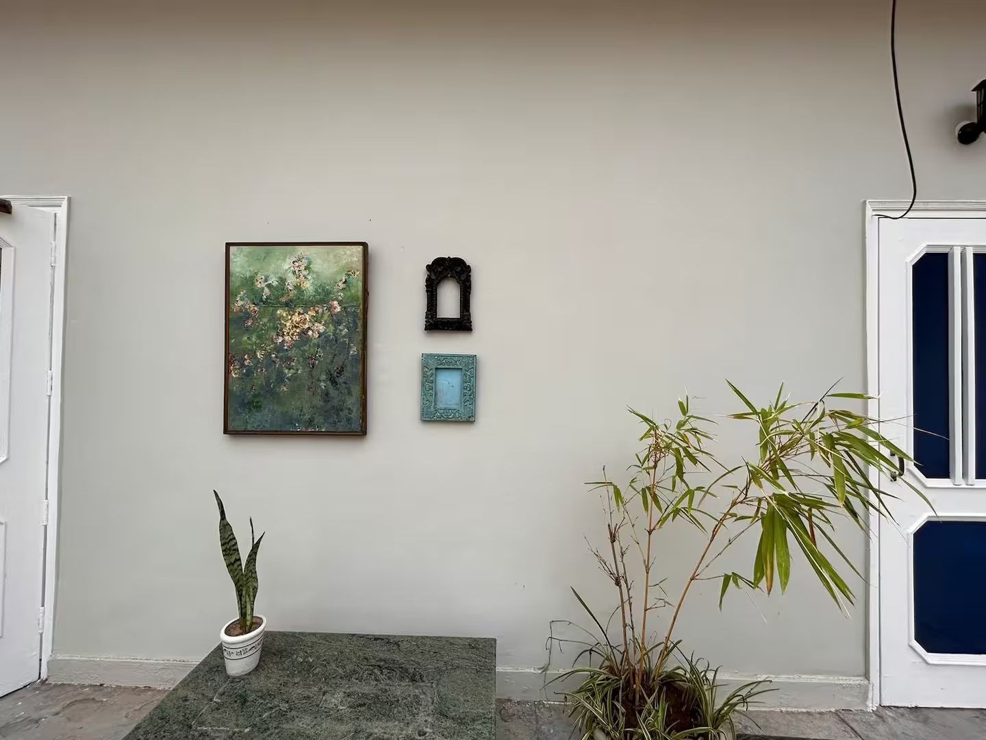 Courtyard Wall with Plants and Artwork