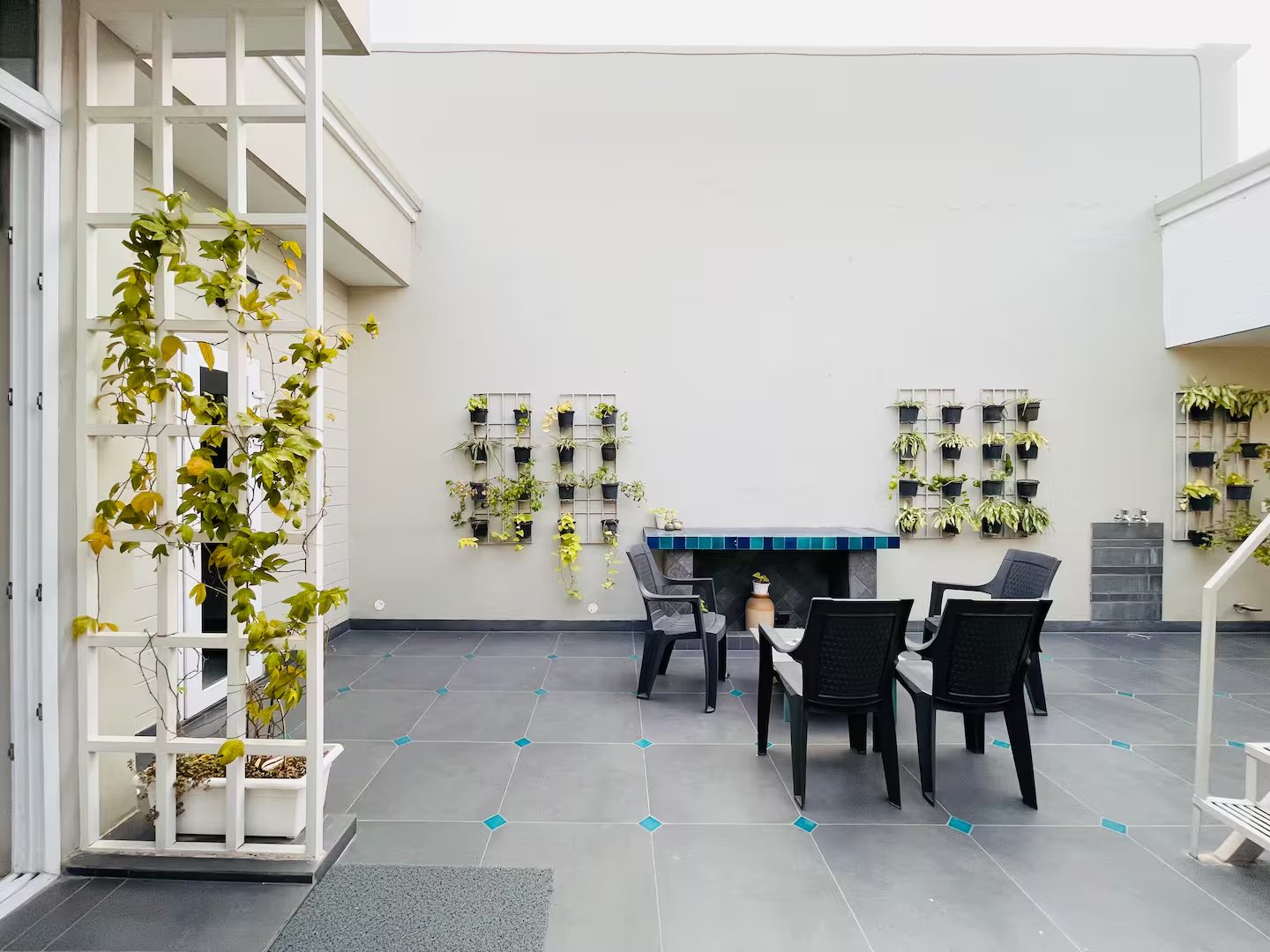 Courtyard Dining Area with Potted Plants